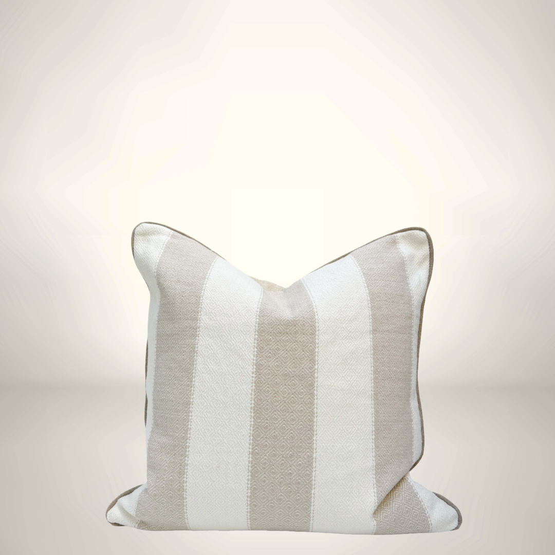 Striped pillow with a light gray and white pattern on a beige background