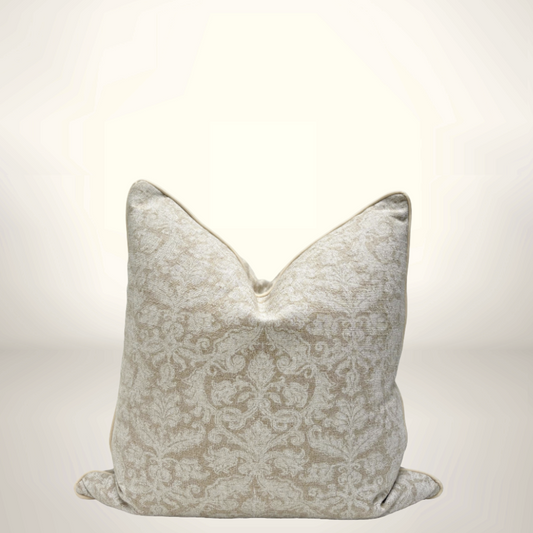 Decorative pillow with a subtle pattern on a light background