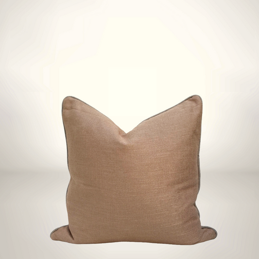 Brown pillow on a light gray background