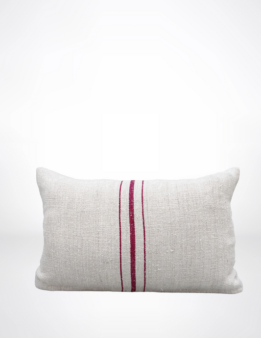 Textured pillow with a red stripe on a white background