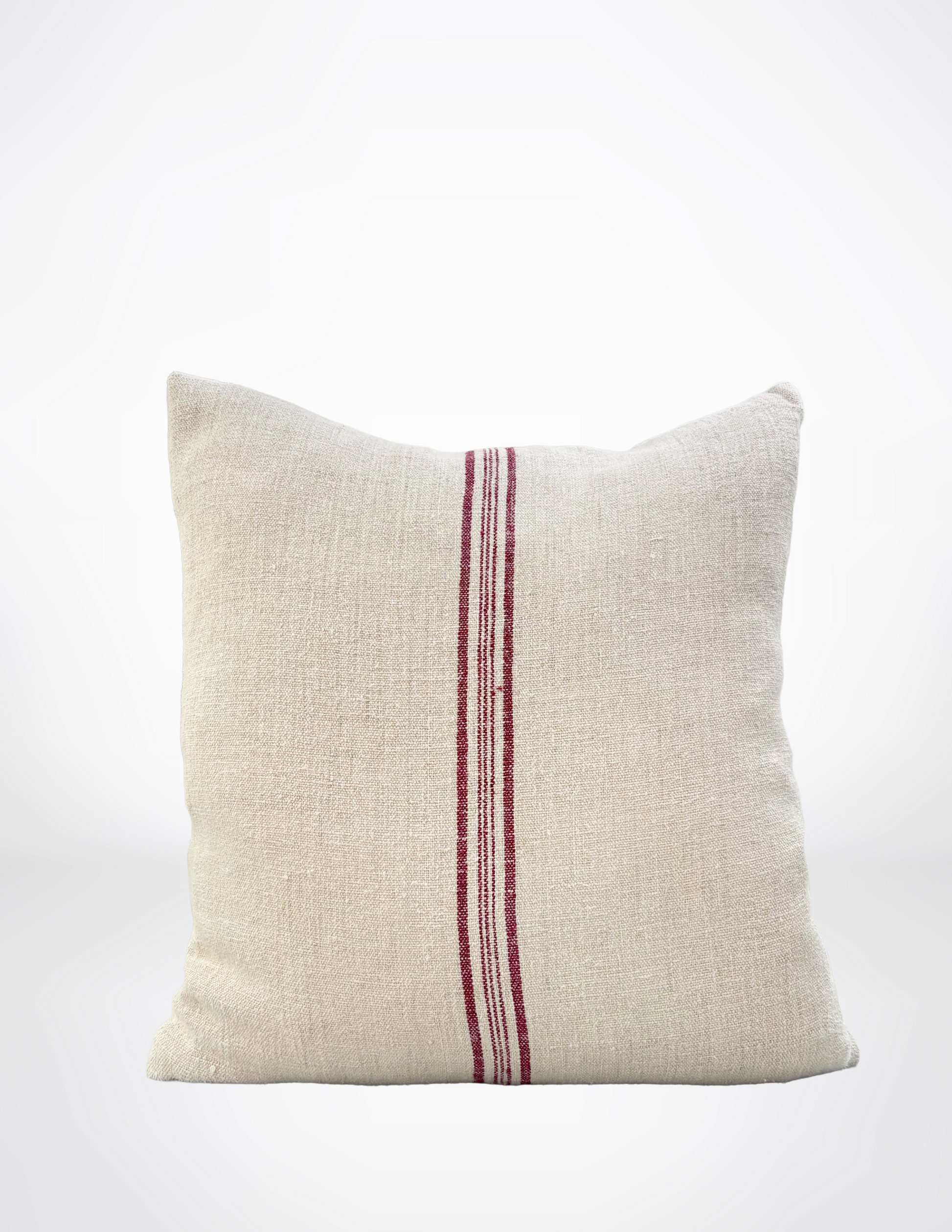Beige pillow with a burgundy stripe on a white background