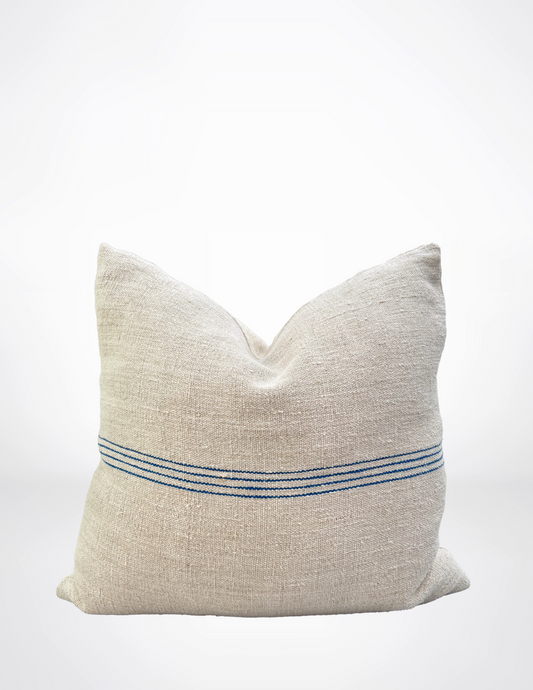 Textured beige pillow with a blue stripe on a white background