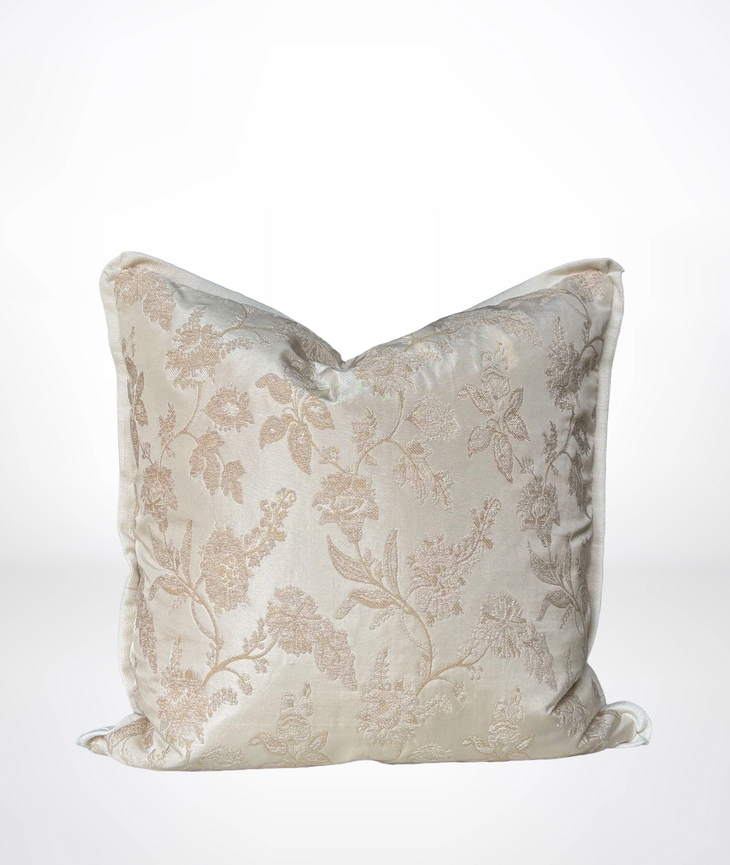 A square decorative throw pillow in a shimmering champagne beige fabric with a subtle tonal floral damask pattern, shown against a clean white background.