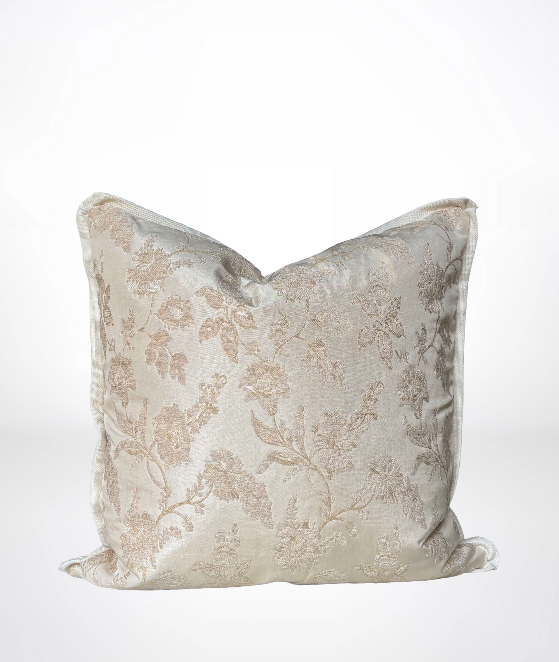 A square decorative throw pillow in a shimmering champagne beige fabric with a subtle tonal floral damask pattern, shown against a clean white background.