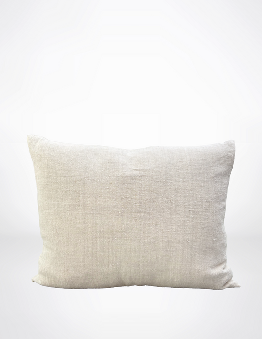 Beige pillow on a white background