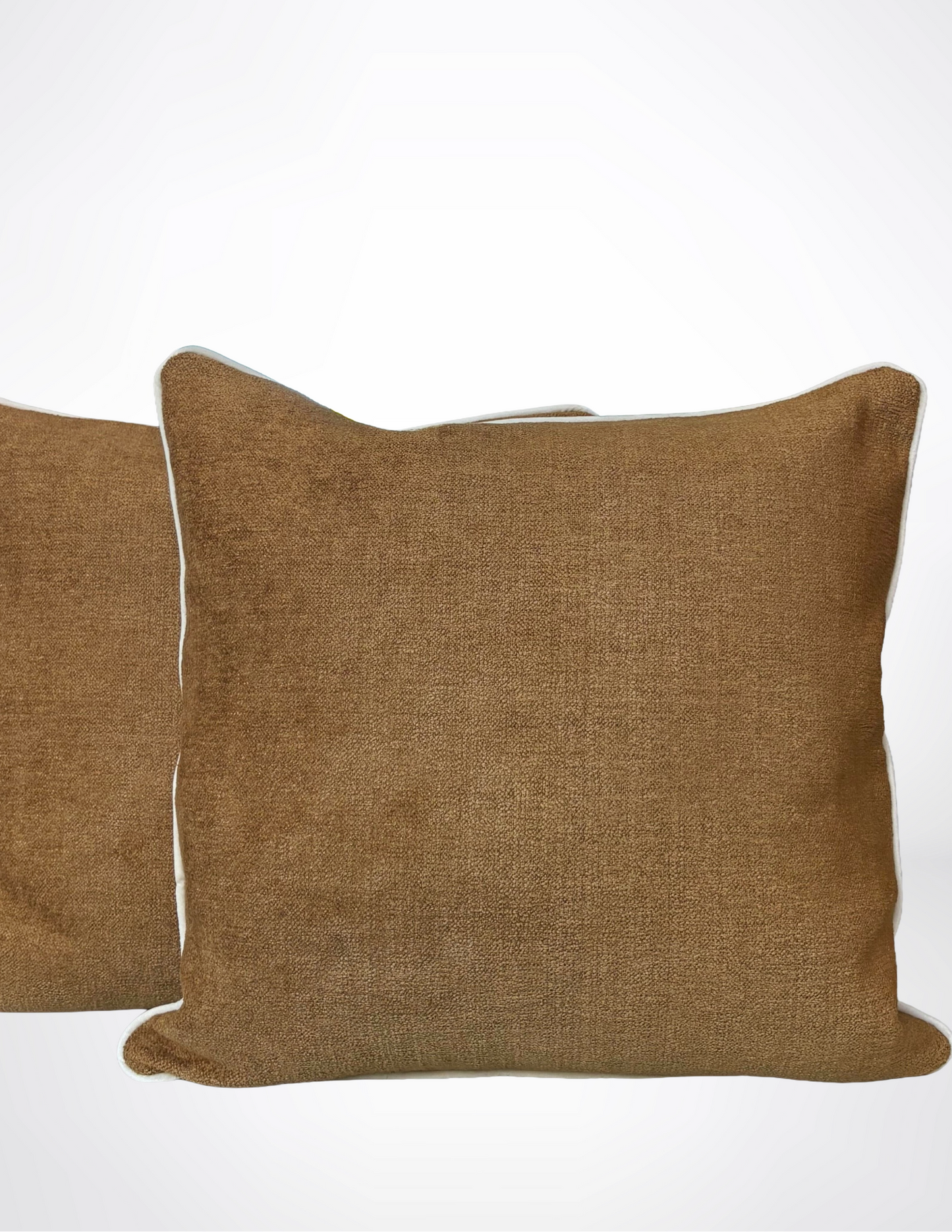 square brown pillows with white piping