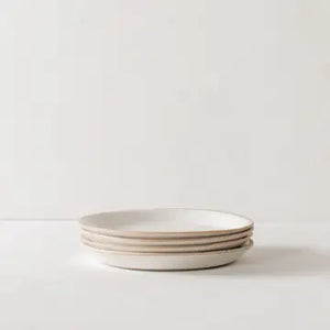 cream colored dinner plate with natural rim