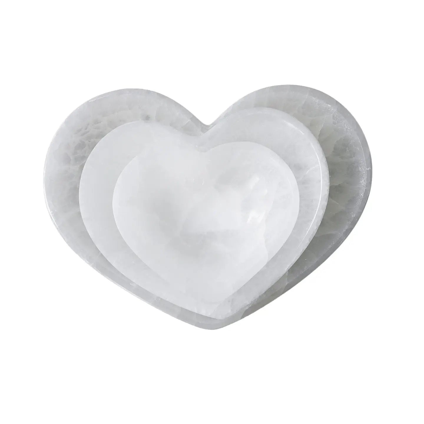 Set of two marble heart-shaped bowls on a white background