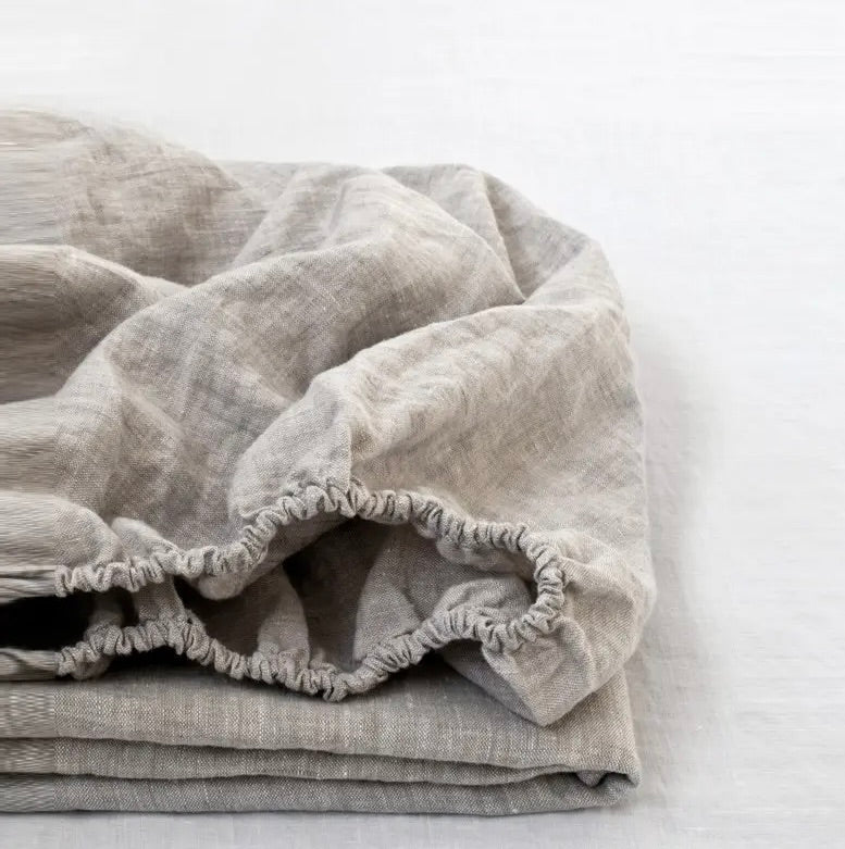 Stack of gray textured fabric on a white background