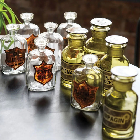 Set of green apothecary jars with lids with vintage inspired labels