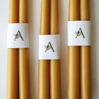 yellow beeswax taper candles