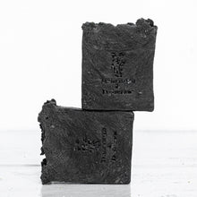Load image into Gallery viewer, black charcoal handmade soap with Tumbleweed sand Dandelion logo stamp