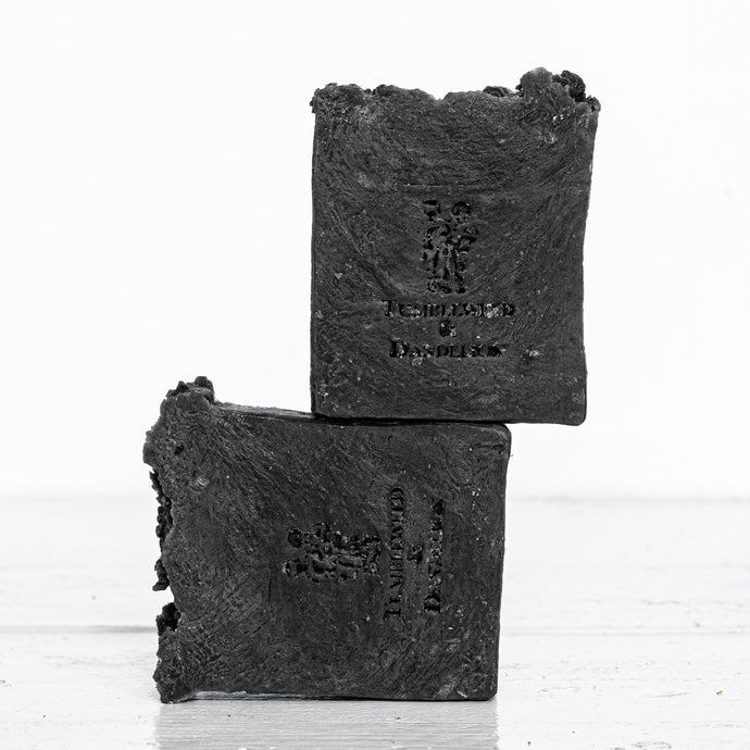 black charcoal handmade soap with Tumbleweed sand Dandelion logo stamp