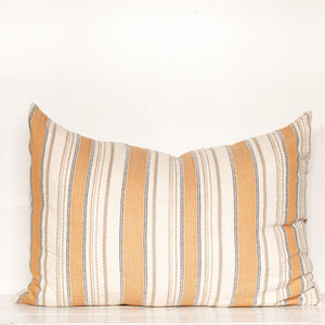 cream, pale orange, tan and black vertical striped rectangle pillow