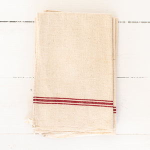 cream colored linen dishtowel with red stripes
