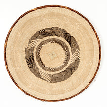 Load image into Gallery viewer, Round woven wicker tray with tan and brown pattern