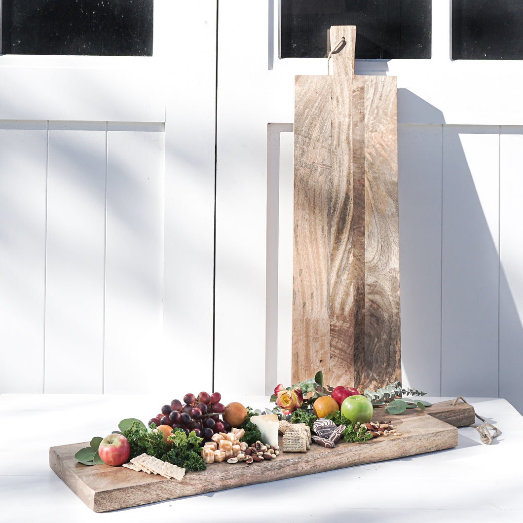 rectangle serving/bread board made of Mango wood, with handle and leather loop for hanging