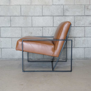 brown leather side chair with black metal frame
