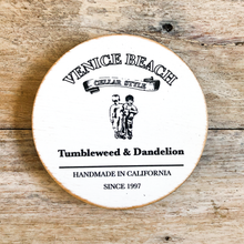 Load image into Gallery viewer, Recycled round wood coaster with Venice Beach text and Tumbleweed and Dandelion logo 