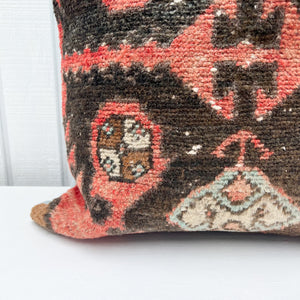 square pillow made from Turkish rug with salmon and black colors