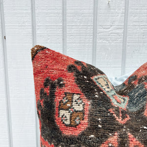 square pillow made from Turkish rug with salmon and black colors