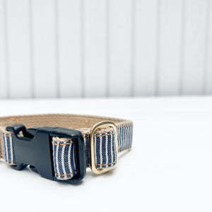 blue and white striped cotton dog collar with black plastic clip and brass ring