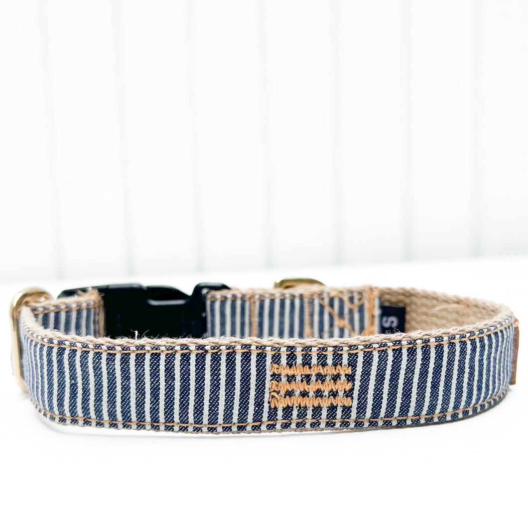 blue and white striped cotton dog collar with black plastic clip and brass ring