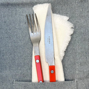 fork and knife with orange handles