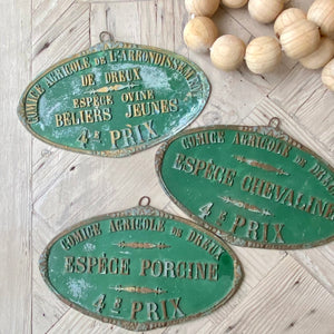green metal vintage French Farmer's award plaque with embossed text in French