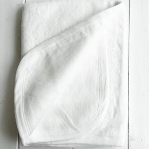 white cotton baby blanket