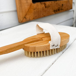 long handle body scrub brush with natural bristles....long handle is removable and brush has a soft handle for hand to slide through for easy usage