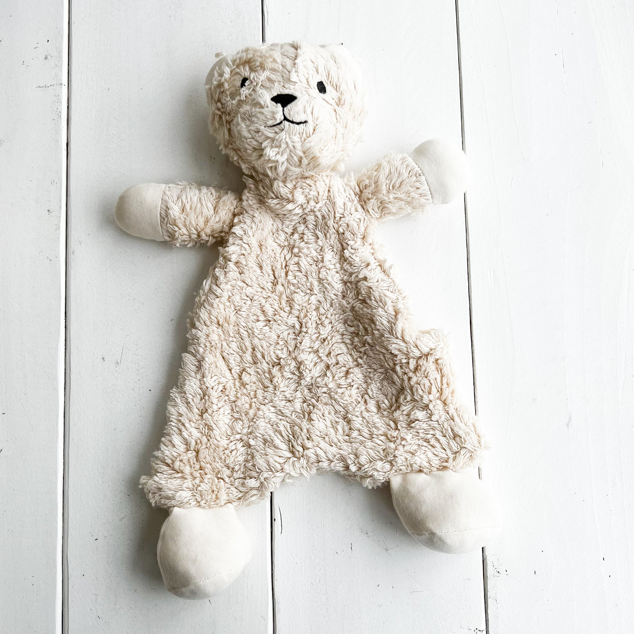 natural colored stuffing free baby snuggle bear made of organic cotton
