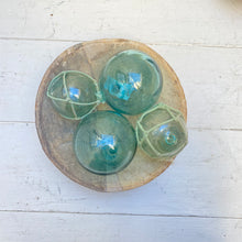Load image into Gallery viewer, round green/blue glass balls, some with rope around them