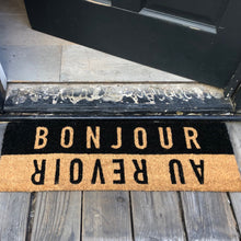 Load image into Gallery viewer, Black and Tan door mat with &quot;bonjour&quot; and &quot;au revoir&quot;