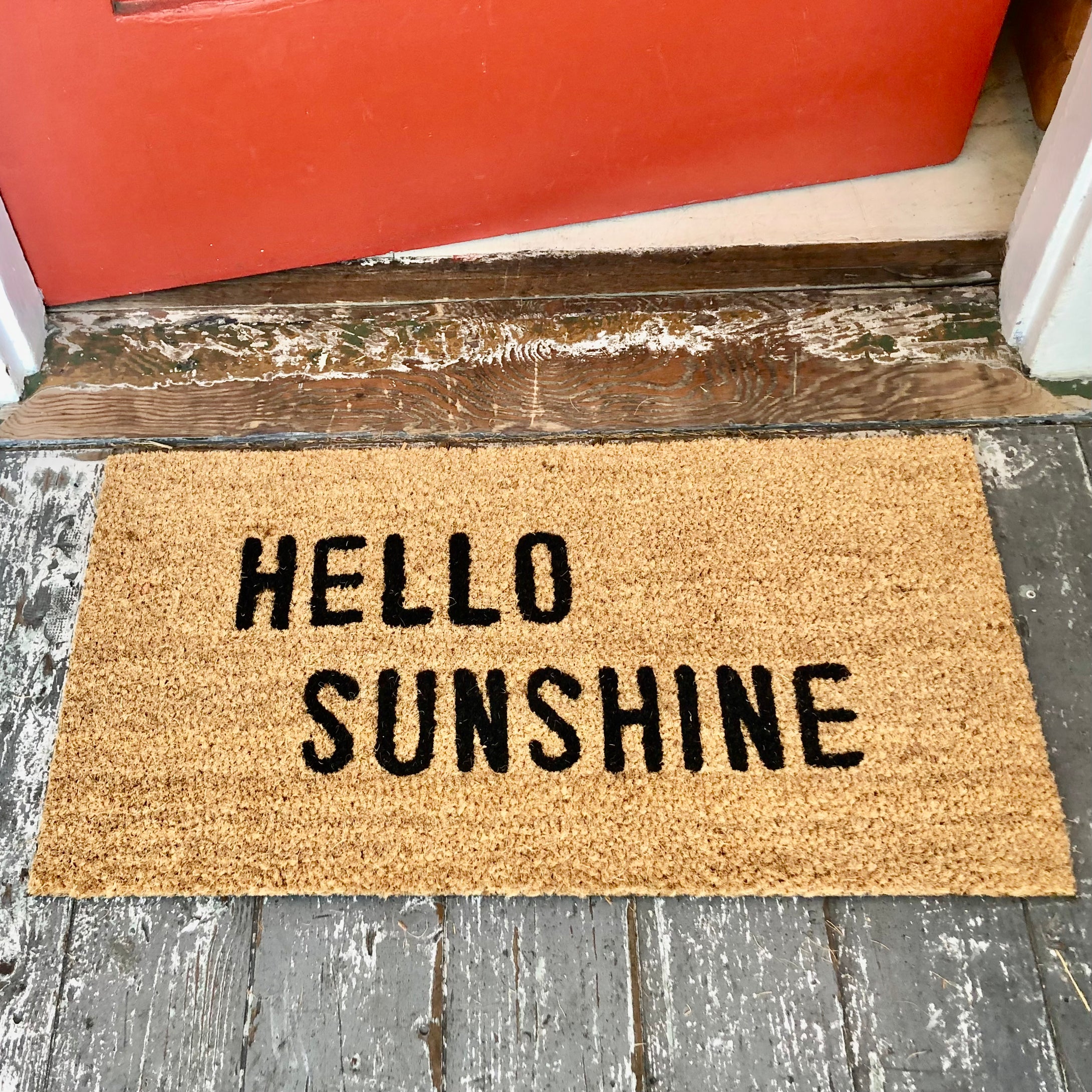 tan door mat with words 