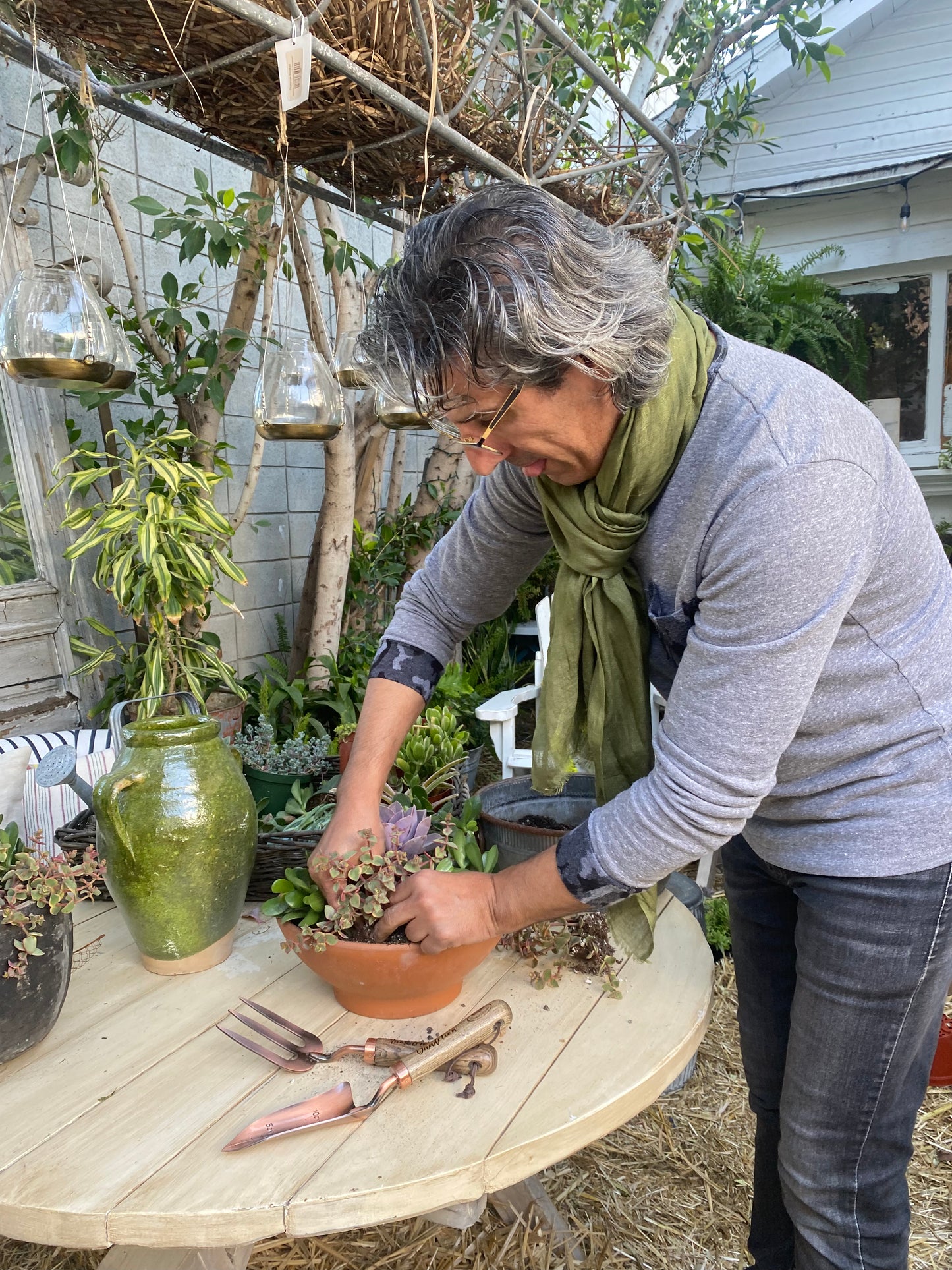 copper fork and trowel garden tool set with wooden handles imprinted with "Tumbleweed" on fork and "Dandelion" on the trowel