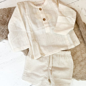 ivory colored shirt and short set, shirt long sleeved with buttons