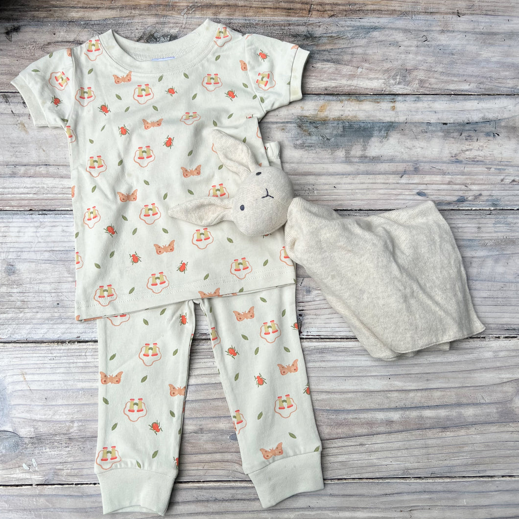 off white short sleeve kid's pajama set with orange butterflies, bugs and binoculars