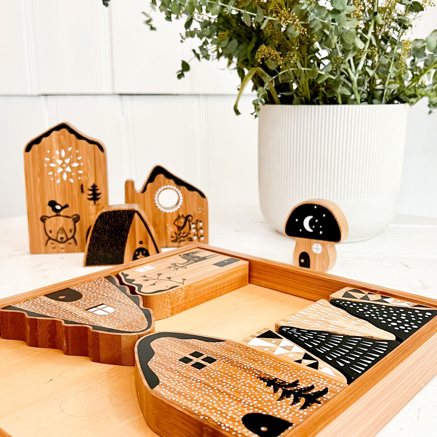 woodland village bamboo baby play set in black, natural wood and white colors