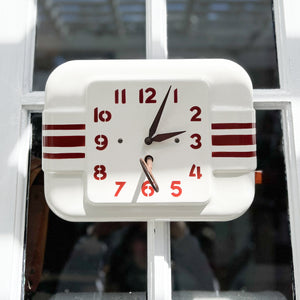 vintage white wall clock with red stripes
