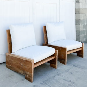 wood outdoor armless lounge chair with white cushions