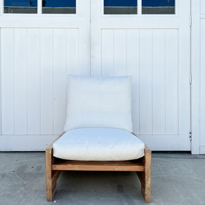 wood outdoor armless lounge chair with white cushions