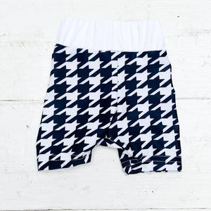 black and white houndstooth patterned baby swim shorts
