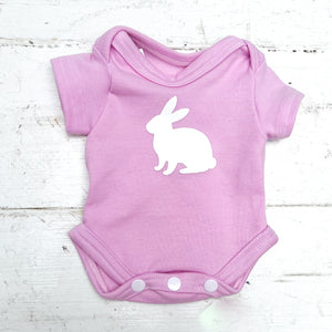 pink short sleeve baby onesie with white bunny on front