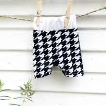 Load image into Gallery viewer, black and white houndstooth patterned baby swim shorts