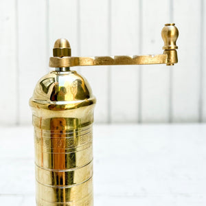 brass salt and pepper grinders with crank handle on the top