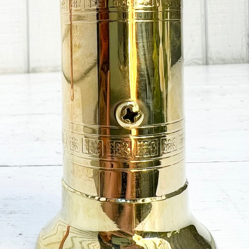 brass salt and pepper grinders with crank handle on the top