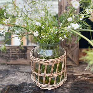 glass jar with rattan wrapped on outside