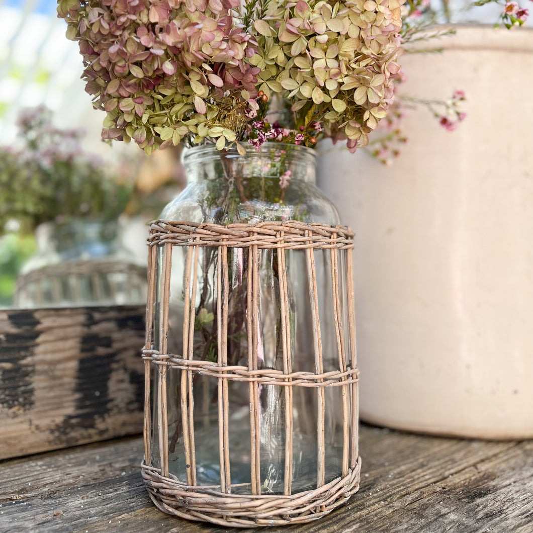 glass jar with rattan wrapped on outside