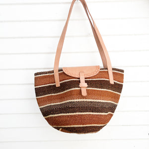 light and dark brown horizontal stripe sisal bag with light leather straps and flap